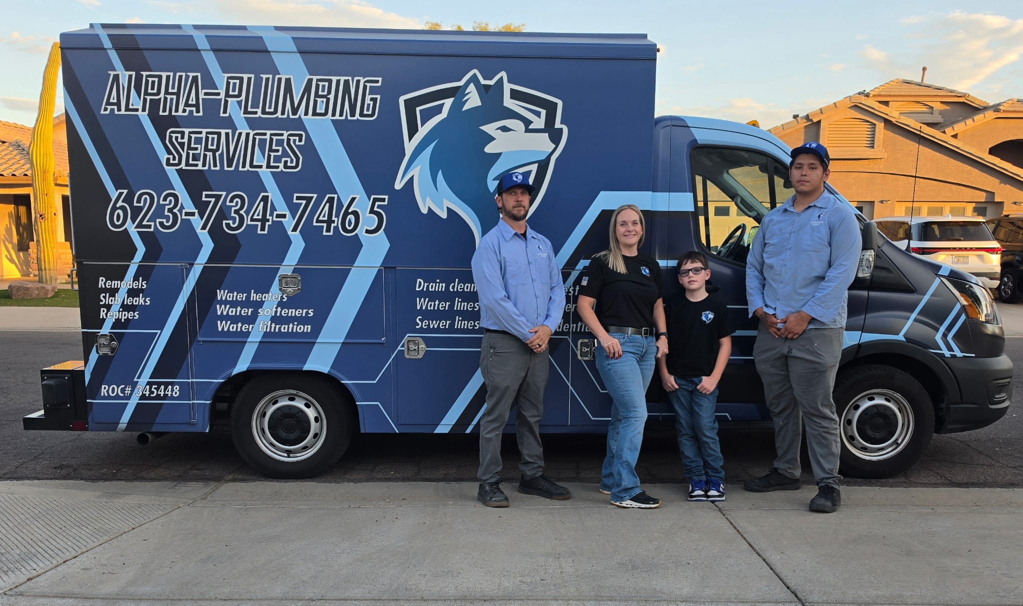 The Alpha-Plumbing Services family team in front of the company truck